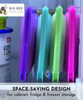 SoftShell Reusable Silicone Food Storage Container With Connected Clamshell Lid Snap Closure displayed in fridge storage.