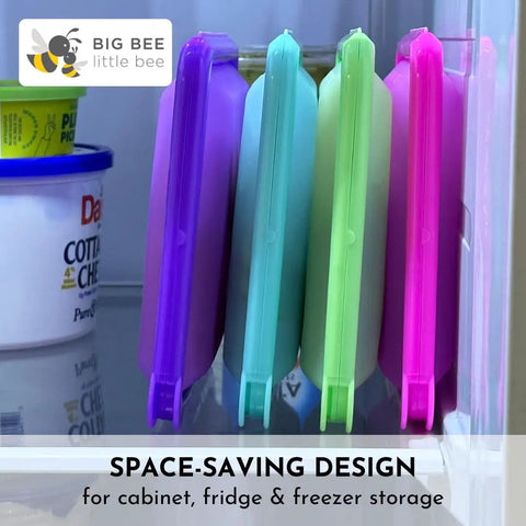 SoftShell Reusable Silicone Food Storage Container With Connected Clamshell Lid Snap Closure displayed in fridge storage.