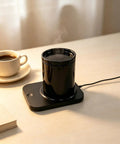 Rapid Heat Electrically Heated Coffee Mug Warmer With 16oz Stainless Steel Cup And Temperature Control Smart Heater on a desk.