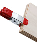 2 Inch Heavy Duty Spring Clamps For Woodworking And Photo Studio Backdrops, Nickel Plated Metal Clips on a wooden board
