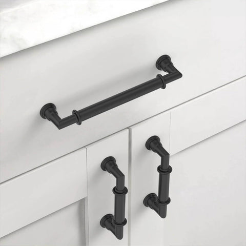 Matte Black 5 Inch Cabinet Handles Set 10 Pack Heavy Duty Solid Metal Kitchen Cabinet Pulls for cupboards and drawers installed on white cabinet.