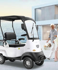 Electric Golf Cart 4 Wheel Mobility Scooter With Cargo Box Heavy Duty Farm Utility Vehicle For Seniors Adults 800W Brushless Motor 60V Battery 12 Mph No Sweat Cruising Easy Roll White parked near waterfront.