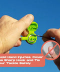 Using Knot Tying Tool For Safe Tackle With Hook Guard Cover And Built In Line Cutter against clear sky.