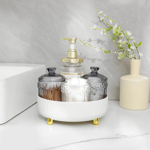 360 Degree Rotating Makeup And Skincare Organizer Tray Lazy Susan on bathroom countertop with jars and pump bottles