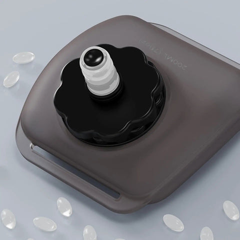 Top view of Hands Free Hydration Wrist Bottle For Runners, 200ml Silicone Leak Proof Water Bottle showing cap and valve details.