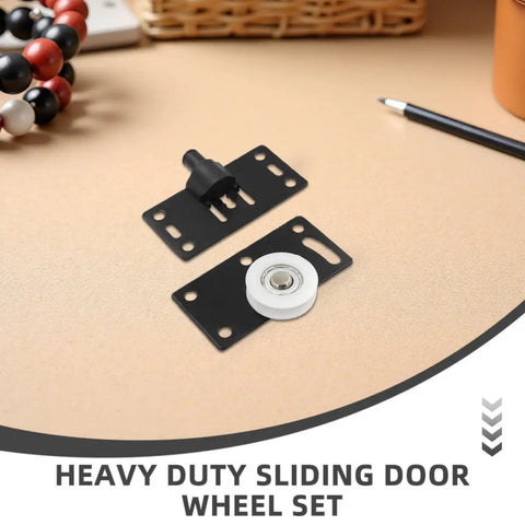 8 Pairs Black Carbon Steel Sliding Door Wheels For Closets And Wardrobes Rock Solid Heavy Duty Cabinet Pulleys Built Damn Tough With Smooth Gliding Performance Runs Like A Dream Daily, includes black sliding wheel set on a beige surface.
