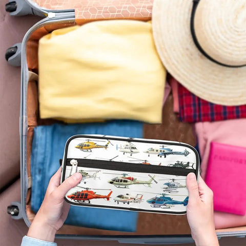 Foldable Travel Toiletry Bag For Women And Men, Water Resistant Dopp Kit with helicopter design in open suitcase with clothes