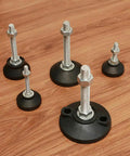 Heavy Duty Adjustable Leveling Feet With Swivel Base And Non Slip Rubber Pads Kills Furniture Wobble Cold On Uneven Floors Nickel Plated Carbon Steel For Machines And Workbenches Set Of Eight displayed on a wooden floor.