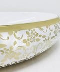 Real Deal Oval Vessel Sink, Solid Ceramic Bathroom Basin With Sleek Gold Finish, intricate floral design detail on the side.