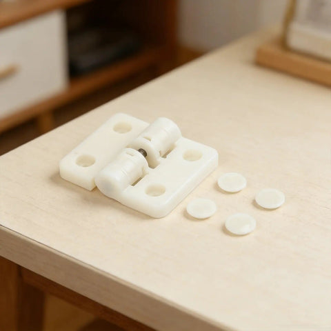 Adjustable Plastic Resin Gate Hinges With 90 And 180 Degree Stop, White, for Outdoor Gates and Garden Fence, shown on table