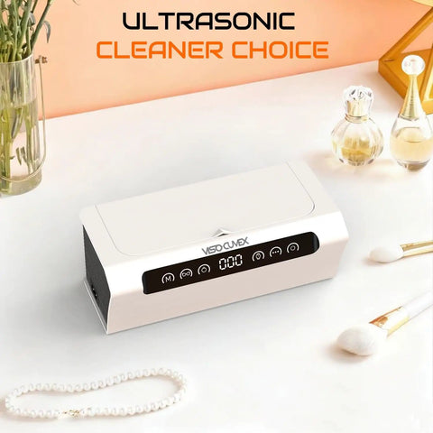Ultrasonic Jewelry Cleaner 45KHz Machine with digital touch control, shown on a countertop surrounded by jewelry and toiletries.
