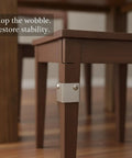 Stainless Steel L Bracket Corner Brace For Furniture Repair Right Angle Support stabilizing a table leg with screws included.
