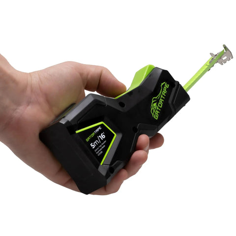Hand holding Top View Internal Reading Precision Retractable Measuring Tape Inches With Magnetic Tip And Lock No Bend Readout