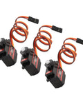 Three Heavy Duty RC Servo Motors Crushing Heavy Loads With Rock Solid High Torsion And Lightning Fast Response, black with orange wires.