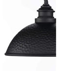 Close-up of Englewood Collection 1 Light Farmhouse Outdoor Post Lantern in textured black with hammered steel shade detail.