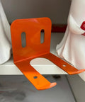 Heavy Duty Iron Power Tool Hanger Wall Mount For Garage And Shed Organization in orange on a shelf