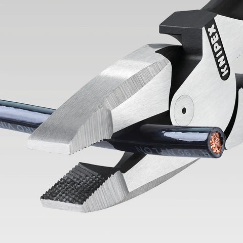 Close-up of High Leverage Lineman Pliers with cable puller, universal mandrel crimping point, and crosswise serrated jaws gripping a cable.