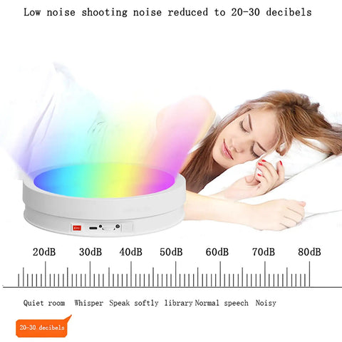 CHANGLKJ Led Rotating Turntable Display Stand With Remote Control 5000 Mah Battery shows colorful LED lighting with a user resting nearby.