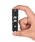 Aurora A23 Tiny Keychain Flashlight That Delivers 1000 Lumens USB C Rechargeable IPX8 Waterproof held between fingers