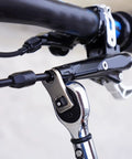 Totally Dead Nuts Precise 8mm Cycling Disc Brake Wrench And Cable Adjuster Tool Hella Reliable Hexagon Design for precise cable adjustment on a bike handlebar.
