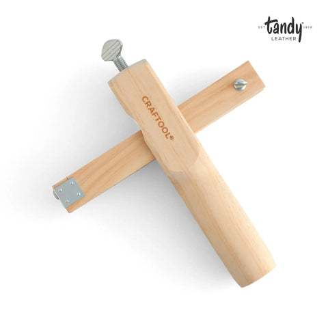 Leather Strap Cutter For Crafts With Adjustable Width Guide And Sturdy Wood Handle For Precise Uniform Belts Handles And Watch Bands Cutting And Controlled Manual Cutting For Professional Leatherwork; top view showing wood handle and metal guide.