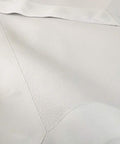 Close-up of Masonic Apron Made From Synthetic Leather, White Mason Apron With Adjustable Belt, Metal Clip, And White Grosgrain Border