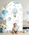 Spandex Arch Backdrop Cover For Baby Birthday And Baby Shower Blue Hot Air Balloon Theme Wrinkle-Resistant Stretch Polyester Backdrop Easy Setup For Photos 7.2 By 4 Feet with baby sitting in front
