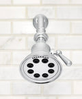 Retro Style Shower Head With Anystream 360 Degree Spray Technology, 1.75 GPM Flow, Polished Chrome Finish against white tile wall