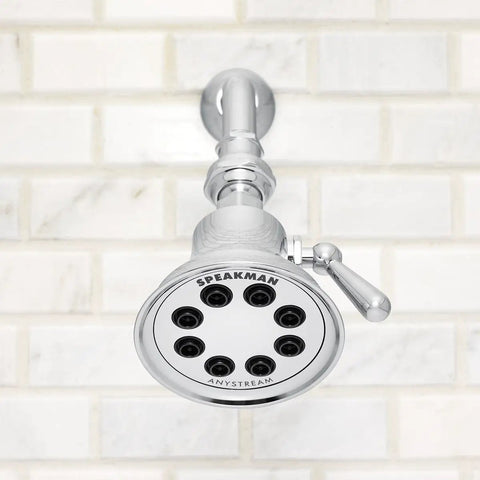 Retro Style Shower Head With Anystream 360 Degree Spray Technology, 1.75 GPM Flow, Polished Chrome Finish against white tile wall