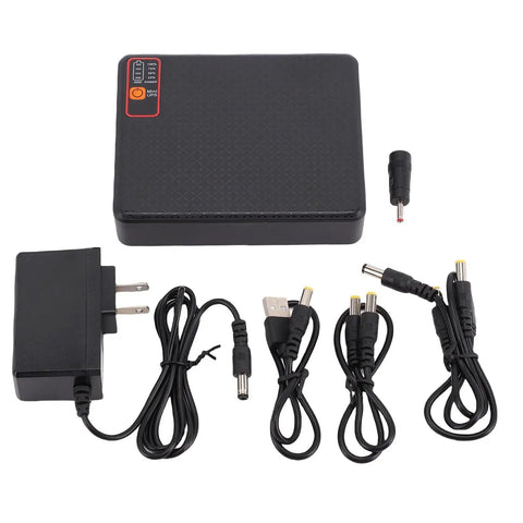 Straight Up Reliable Compact Us Plug Ups Battery Backup For Routers And Modems Delivers 12000Mah Reserve Power, includes power adapter and cables.