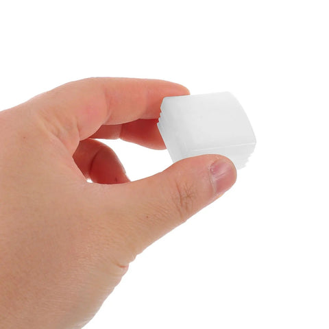 Hand holding a white plastic cap from Bedside Rail End Caps 10 Pack For Bed Safety Rails 1.2x1.2 Inch Handrail Protectors.