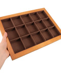 Sleek Walnut Jewelry Organizer Tray With 15 Slot Grid For Ring Bracelet Necklace Storage And Display, held to show detail.