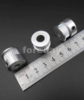Heavy Duty Alloy GT2 Synchronous Timing Pulley Five Pack With 25 Teeth 6mm Wide And 8mm Bore, showing three pulleys and a measuring ruler.