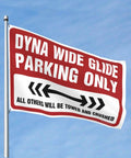 Outdoor flag reading 'Dyna Wide Glide Parking Only, All Others Will Be Towed and Crushed' in red and white with arrows