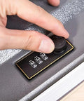 Close-up of a hand using the smooth turntable code dial on a keyless mechanical combination lock for cabinets and drawers.
