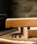 8 Piece Wood Dowel Pins Alignment Tool Set with solid wood tenon center points on a wooden surface