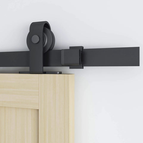 Close-up of 6 Ft Sliding Barn Door Hardware Kit With Top Mounted Track for Aluminum Glass Doors, matte black nylon wheel system.