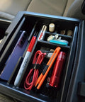 Toyota Tacoma Center Console Organizer Tray for 2024-2026 models with essentials like phone, cords, pens neatly arranged.