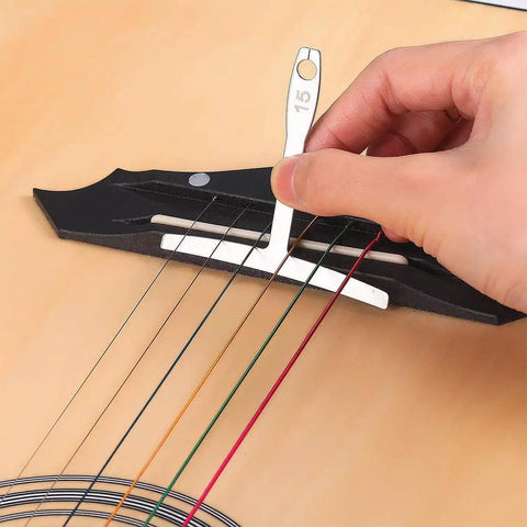 Using Guitar Luthier Tool Set With 13 Stainless Steel Bridge Saddle Nut Files, 9 Understring Radius Gauges, And 9 Sheets Sandpaper for setup