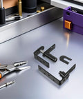 Heavy Duty Double-Sided Self-Closing Door Hinges With Spring Mechanism, Black Finish, Smooth Steel Build, For Interior And Exterior Bar Doors, Easy One-Handed Self-Closing Action, Ideal Hardware For Bar Counter, black steel hinge parts on table