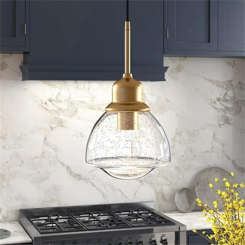 8.12-Inch Wide Pendant Light With Brass Seeded Glass Shade Schoolhouse Bell Style Dimmable E26 Fixture in kitchen setting