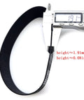 Measurement of black ribbed automotive belt using caliper, height 1.91mm or 0.08in, close-up view