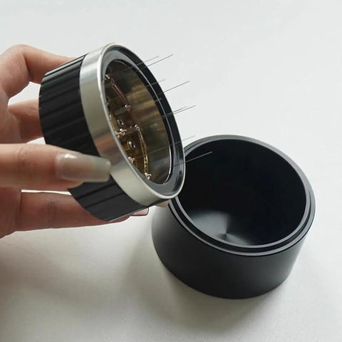 Next Level 58mm Coffee Distributor Needle With Solid Black Base Precision Gear Spin Drive displaying needle arrangement and black base.