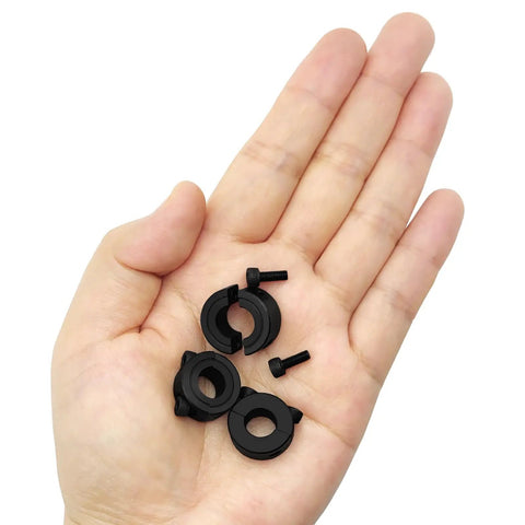 Close-up of Double Split Shaft Collars 5/16 Inch Bore Clamp-On Black Oxide Carbon Steel Solid Rings in hand.