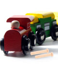 Solid Wood 20 Piece Miniature Nails Set For Crafts And Model Building shown with toy train wheels