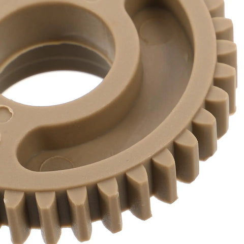 Beefed Up Replacement Gear For Electric Cup Sealing Machines Made From Durable Plastic, Helps Prevent Leaks And Spills, Stable Performance For Beverage Service, Easy Install And Long Lasting Wear, beige plastic gear close-up