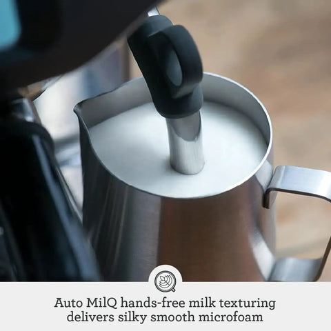 Top Shelf Automatic Espresso Machine With Built In Grinder And Smart Touchscreen For Effortless Milk Frothing Zero Hassle Latte Making In Glossy Black Truffle Finish with milk frothing steam wand and textured milk jug.