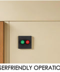 Industrial 2 Button Control Station With Emergency Stop And Start Push Buttons For Workshop Motor And Fan Control, Plastic Surface Mount Switch Panel For Reliable Shutdown And Easy Maintenance. surface-mounted black panel with green START and red STOP buttons on wall