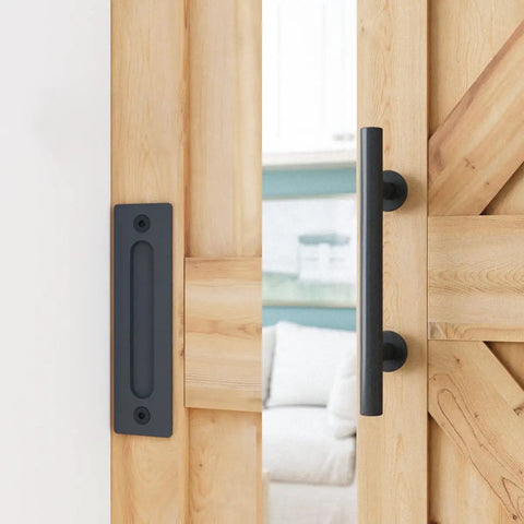 Built Like A Tank 7 Foot Sliding Barn Door Hardware Kit featuring steel handles on a wooden barn door.