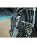 Close-up of Go To Outdoor Mist Cooling Fan With 18 Inch Blade, 5 Speed Settings, Delivers Up To 5,000 CFM by a poolside